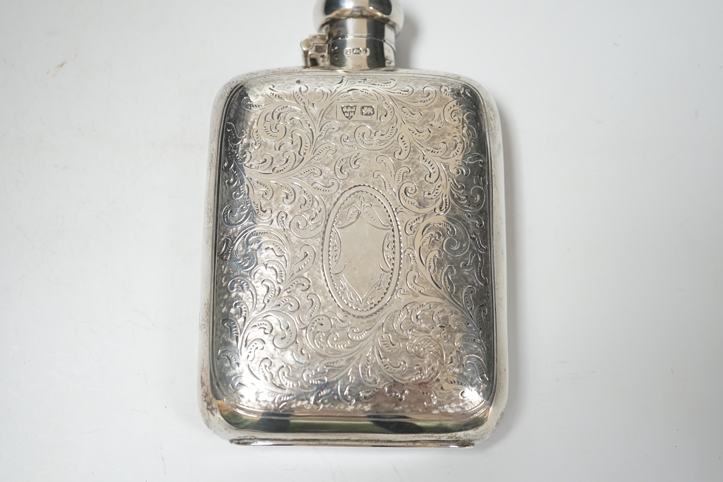 An Edwardian engraved silver hip flask, G & JW Hawksley, Sheffield, 1901, 13.7cm.